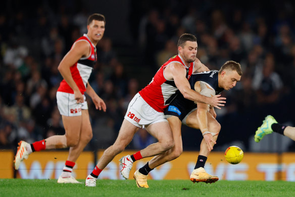 Carlton’s Patrick Cripps is tackled by Saint Brad Crouch.