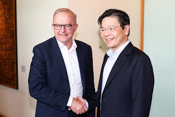 Prime Minister Anthony Albanese and Singapore Prime Minister Lawrence Wong greet each other ahead of a meeting over afternoon tea.