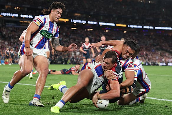 Billy Smith crosses for the Roosters.