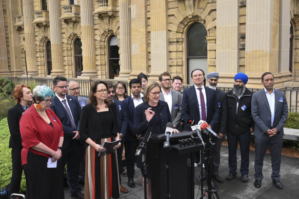 Premier Jacinta Allan (centre) and Attorney-General Jaclyn Symes (in striped skirt) with members of multicultural and advocacy groups on Tuesday.