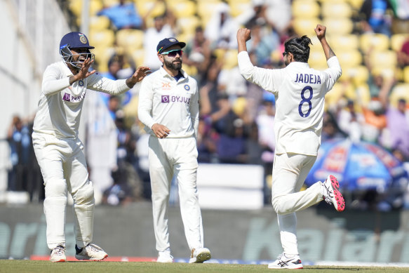 India’s Ravindra Jadeja (right)  celebrates the wicket of Peter Handscomb during the first day of the first Test in Nagpur.