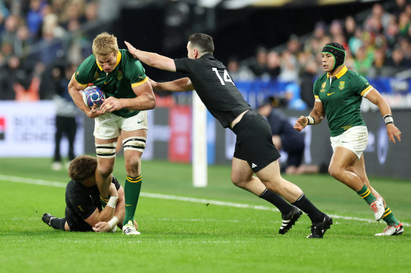 Pieter-Steph Du Toit is tackled by Jordie Barrett