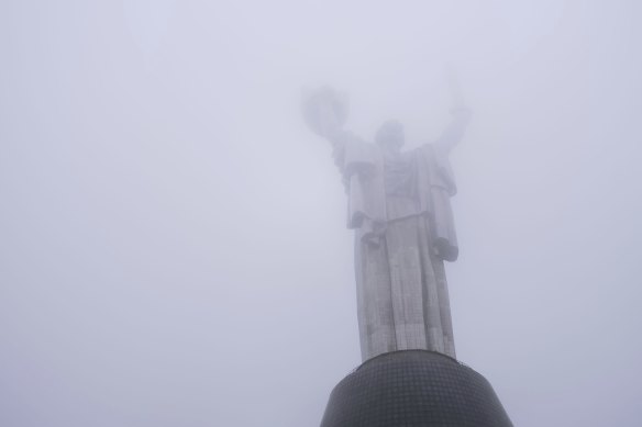 The Motherland monument, which has just reopened for public viewing, is seen through fog in Kyiv, Ukraine.