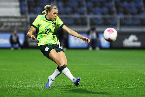Charli Grant passes the ball. 
