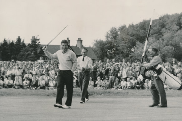 Australian Peter Thomson acknowledges the crowd after winning his third consecutive British Open Golf Championship in 1956.