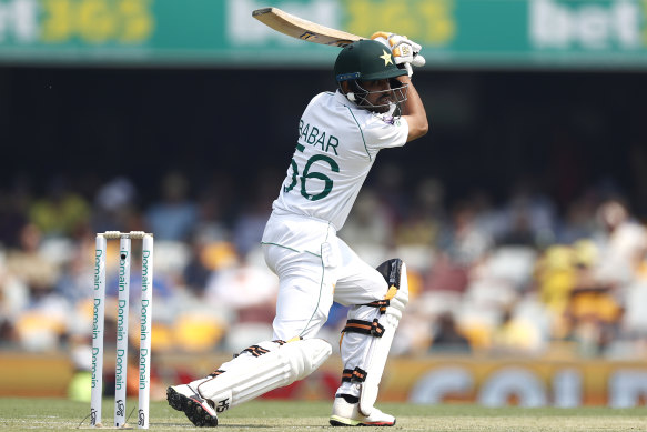 Babar Azam takes a swing and is caught off the bowling of Josh Hazlewood on day one at the Gabba.