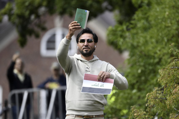 Protester Salwan Momika appears outside the Iraqi embassy in Stockholm before burning the Koran and the Iraqi flag.