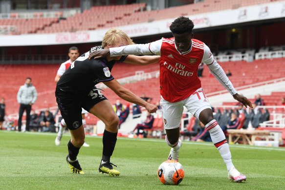 Arsenal's Bukayo Saka takes on Charlton's George Lapslie during the Gunners' 6-0 practice match win.