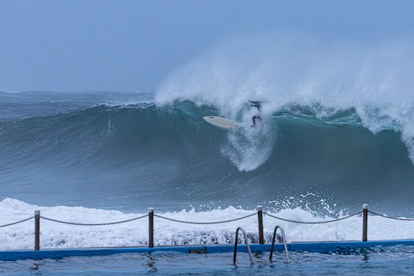 Surfers take to Dee Why Beach to make the most of the coastal low as it bears down the NSW coast.