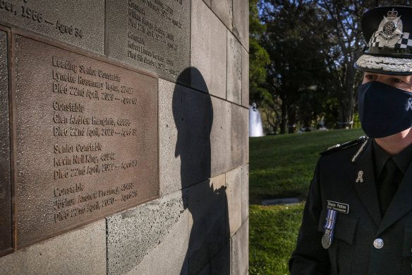 Chief Commissioner Shane Patton in front of the new memorial plaque for the four police officers. 