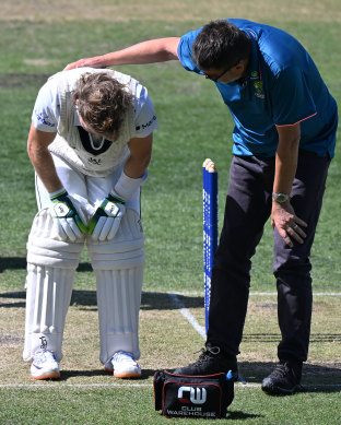 Will Pucovski is attended by medical staff after being struck on the helmet on Sunday.