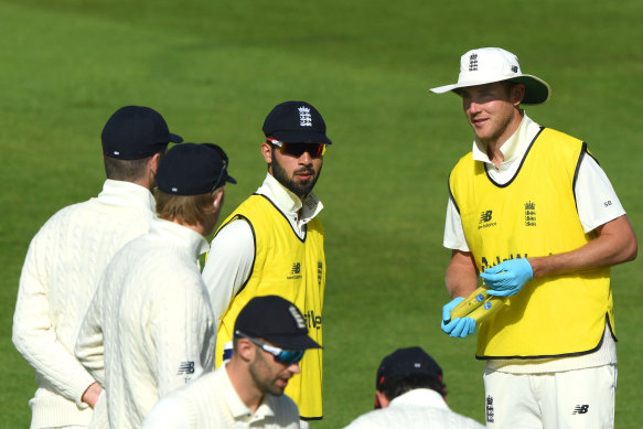 Stuart Broad speaks to teammates during a break in play on day three  of the Test match against the West Indies in Southampton.