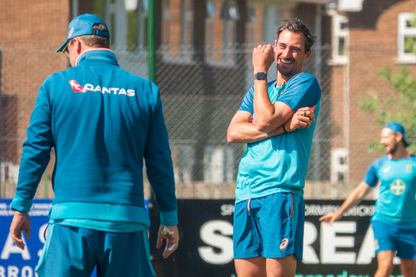 Mitch Starc has a laugh at training.