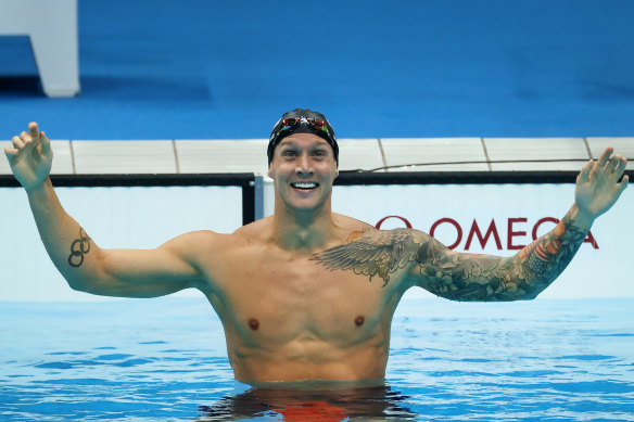 Caeleb Dressel  reacts after winning the gold medal in the Men’s 100m freestyle final at the Tokyo 2020 Olympics.