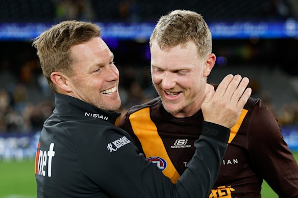 Hawthorn coach Sam Mitchell with Sicily.