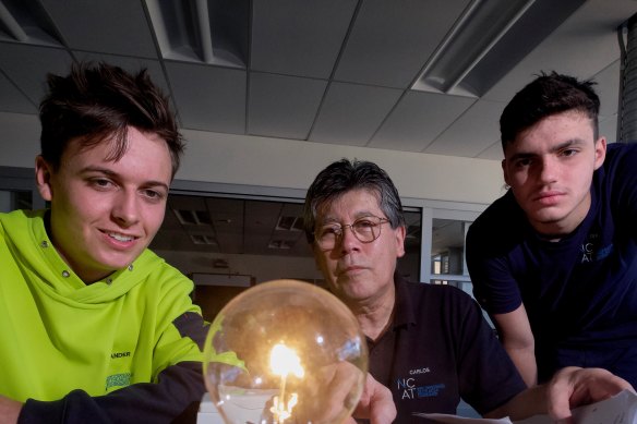 Northern College of the Arts and Technology students Alex Hosking and Isaac Lanza with electrotechnology teacher Carlos Rozales. 