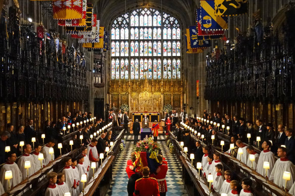 The Queen’s coffin is carried by pall bearers in St George’s Chapel, Windsor Castle.