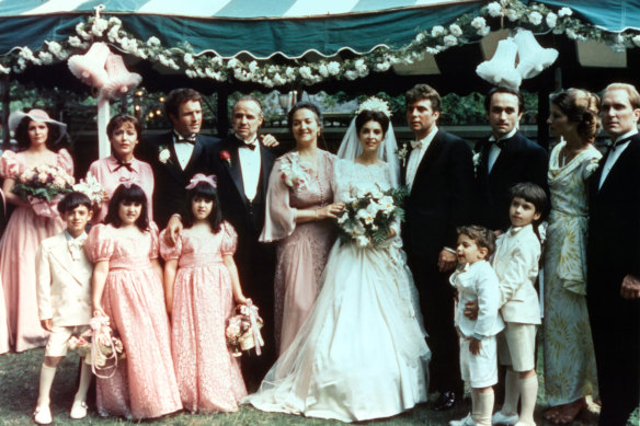 The Corleone family gathers for a wedding in the opening scenes of The Godfather. 