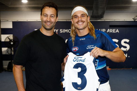 Jimmy Bartel presents Bailey Smith with his Geelong jumper.