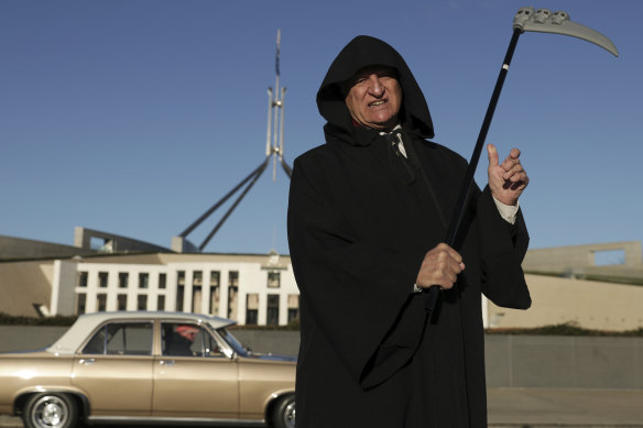 Bob Katter dressed as the grim reaper at a press conference discussing a motion supporting the re-establishment of Australian car manufacturing in June 2020.