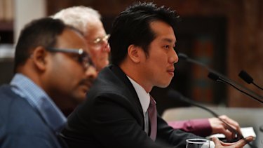 Alton Chen, right,, with other apartment owners from Mascot Towers at the inquiry.
