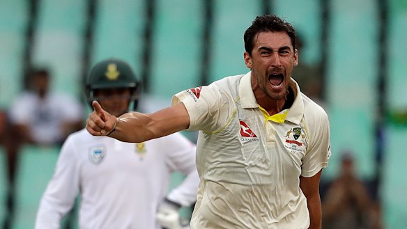 Australia's Mitchell Starc celebrates after bowling South Africa's Kagiso Rabada for a duck on day four of the first Test match at Kingsmead.