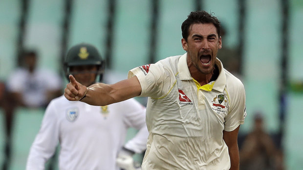 Australia's Mitchell Starc celebrates after bowling South Africa's Kagiso Rabada for a duck on day four of the first Test match at Kingsmead.