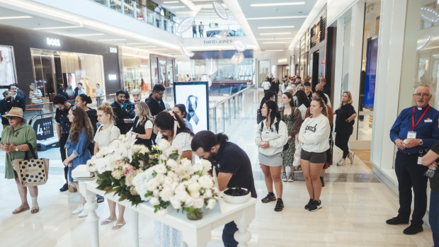 Dozens of bouquets and hundreds of moments of sorrow: Inside Westfield Bondi Junction