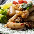 Pad kee mao made with rolled rice noodles.