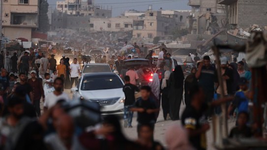 Palestinians flee parts of Khan Younis after an Israeli evacuation order.