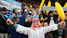 Fans of Manchester City celebrate.