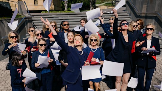 Kirsha Kaechele (centre) and supporters celebrate the Ladies Lounge Supreme Court verdict on Friday morning.