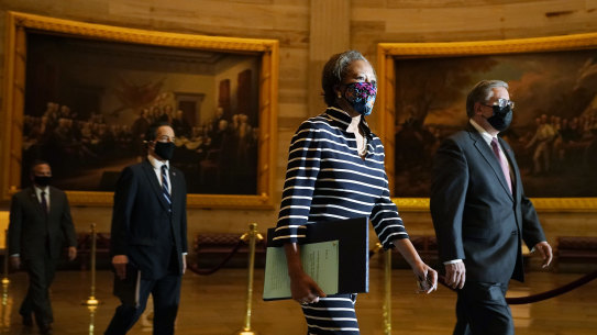 Clerk of the House Cheryl Johnson along with acting House Sergeant-at-Arms Tim Blodgett, lead the Democratic House impeachment managers as they walk through Statuary Hall in the Capitol, to deliver to the Senate the article of impeachment against former president Donald Trump.