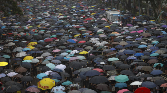 Protesters make space for an ambulance to travel during a rally in Hong Kong.