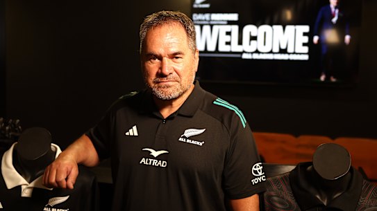 Dave Rennie posing in his new All Blacks attire.