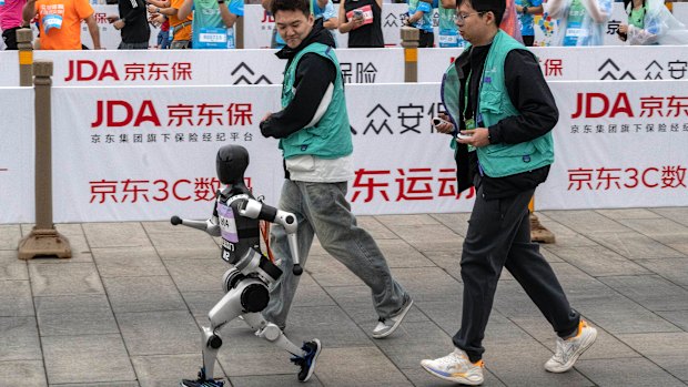 A robot competes in a half-marathon in Beijing. 