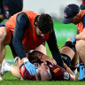 Queensland’s Connor Vest receives medical assistance on Friday.