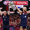 Melbourne coach Simon Goodwin and captain Max Gawn lift the premiership cup last year.