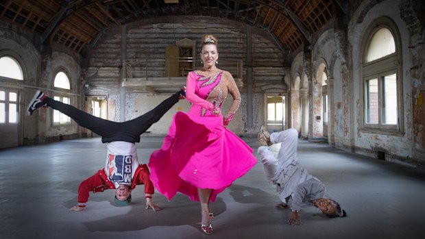 Rising artistic director Hannah Fox, centre, with breakdancers Michael Fox and Demi Sorono in the Flinders Street Station ballroom.