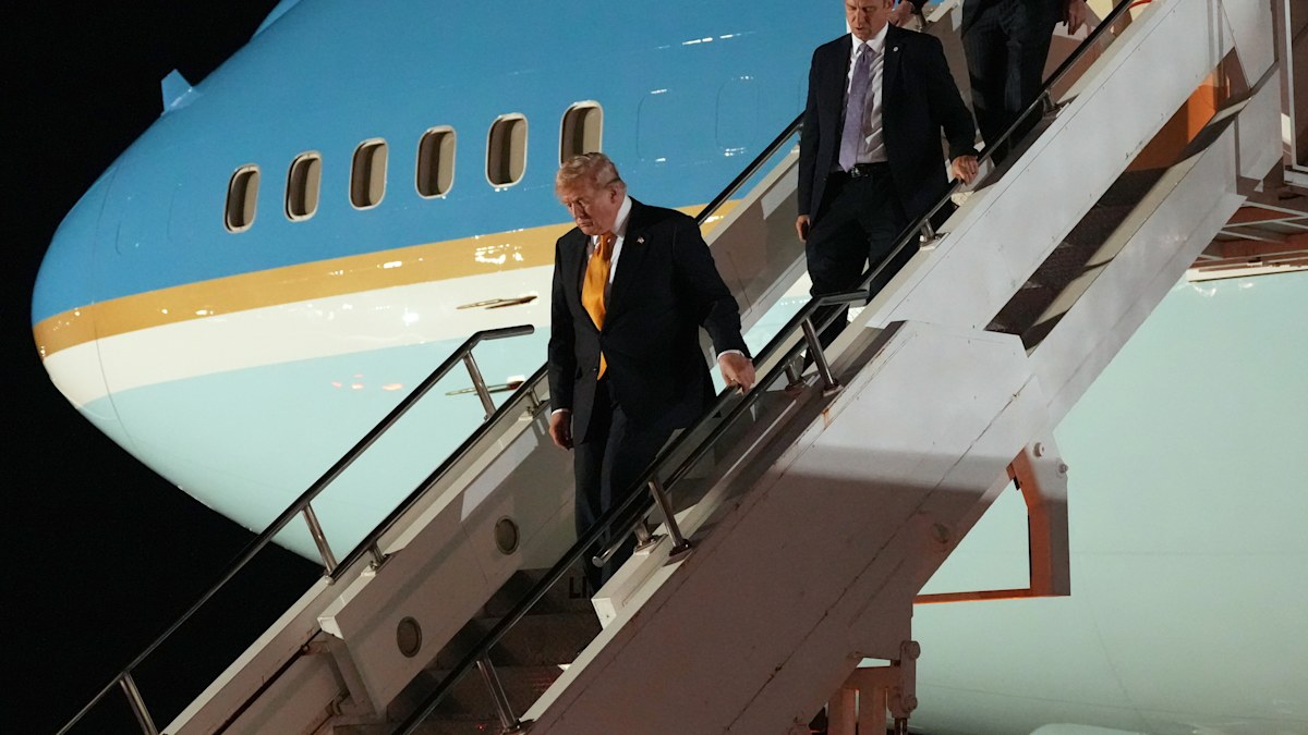 Trump invokes assassination threat as he switches new Air Force One for older plane