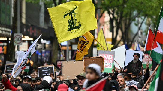 A Hezbollah flag is seen during the pro-Palestine rally for Gaza and Lebanon at the State Library of Victoria.