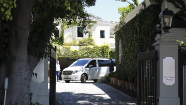 A hearse leaves the home of former South African president F.W. de Klerk in Cape Town on Thursday.