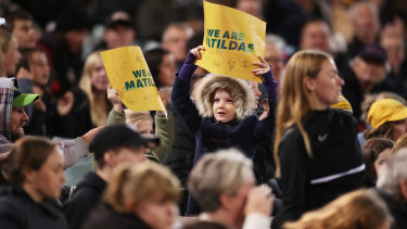 A young fan cheers for the Matildas in their friendly match against New Zealand in Canberra.