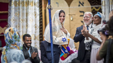 Israeli Justice Minister Ayelet Shaked receives traditional clothes from members of Ethiopia's Jewish community on Sunday.