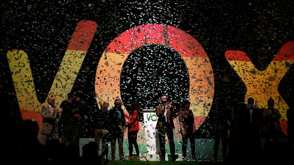 Santiago Abascal, the national president of Vox, centre, applauds during a rally of the far-right party in Madrid, Spain.