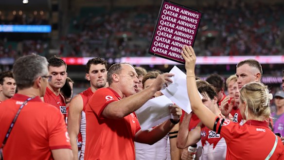 John Longmire speaks to his players at three quarter time