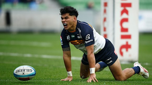 “It’s personal”: Noah Lolesio scores against the Rebels at AAMI Park in Melbourne on Sunday. 