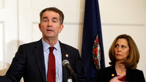 Virginia Governor Ralph Northam, pictured with his wife, Pam, is resisting calls to resign.