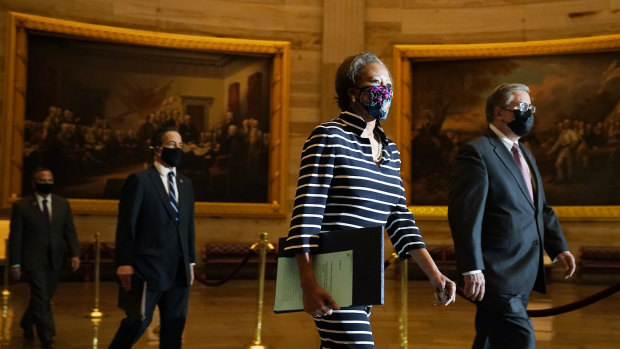 Clerk of the House Cheryl Johnson along with acting House Sergeant-at-Arms Tim Blodgett, lead the Democratic House impeachment managers as they walk through Statuary Hall in the Capitol.