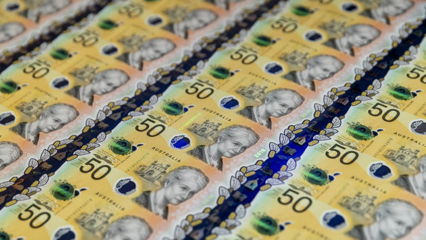 The new $50 note is revealed at Vision Australia in Melbourne.